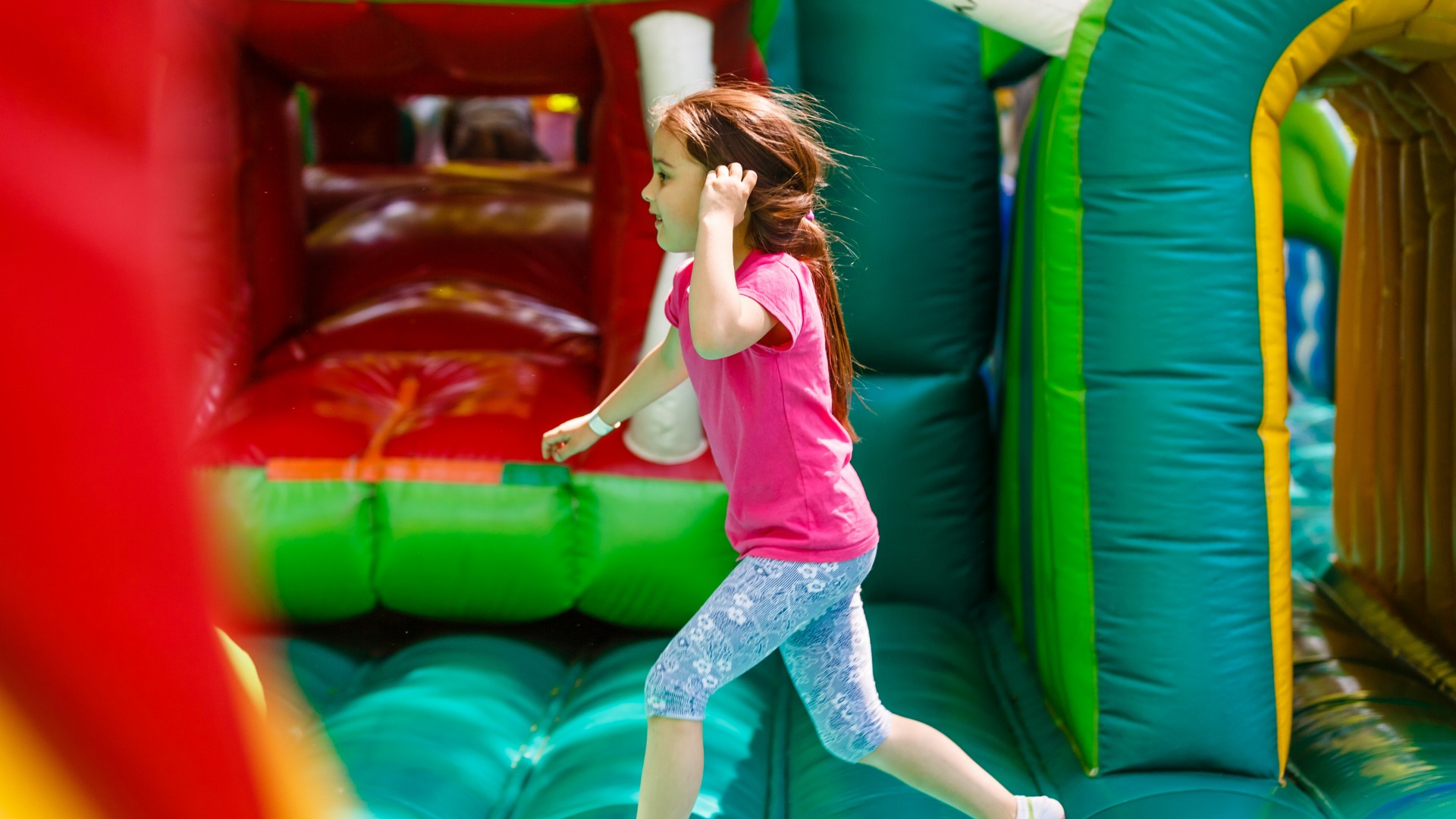 Child Playing in Bounce House